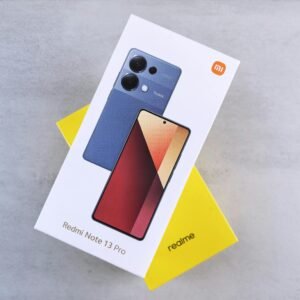 Close-up of Redmi Note 13 Pro phone box with sleek design on neutral background.